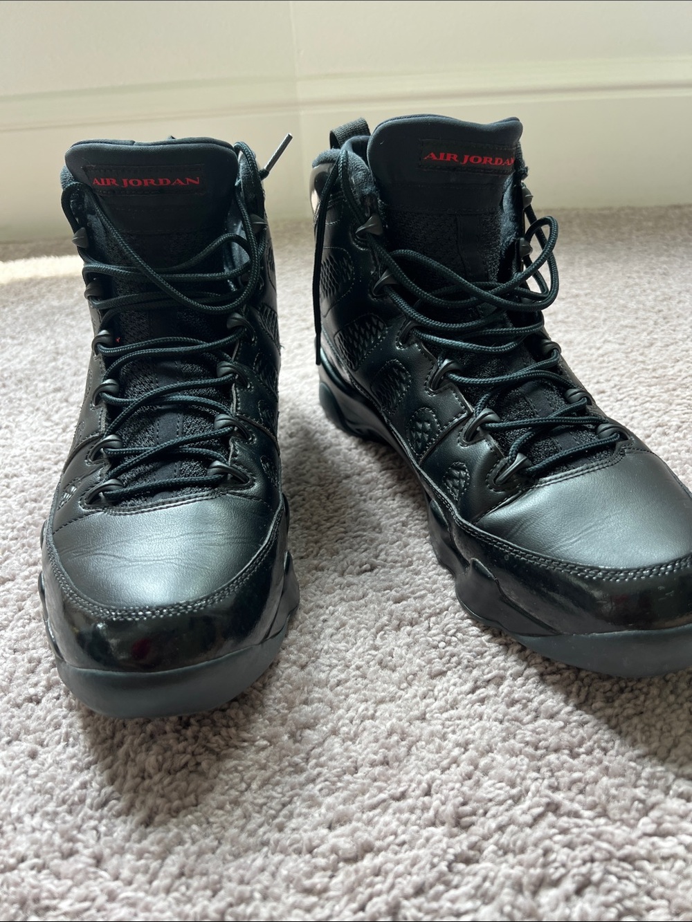 Jordan Black High-Top Sneakers with Red Accents